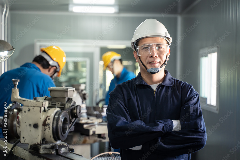 Portrait of engineer man crossing arms and looking at the camera.