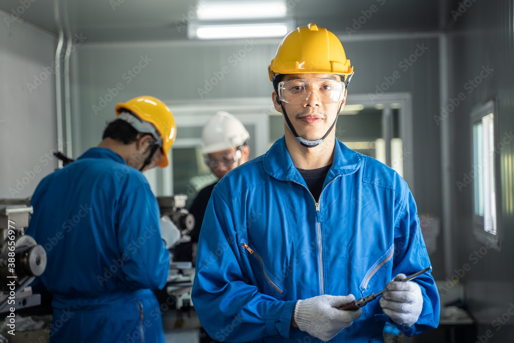 Portrait of technician man holding hand tool and looking at the camera