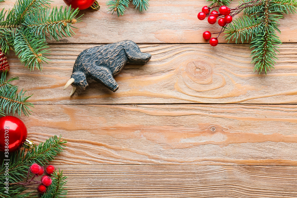 New Year composition with figurine of bull on wooden background