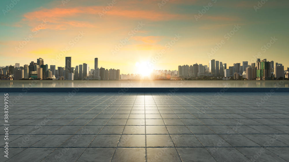 Empty concrete tiles floor with city skyline