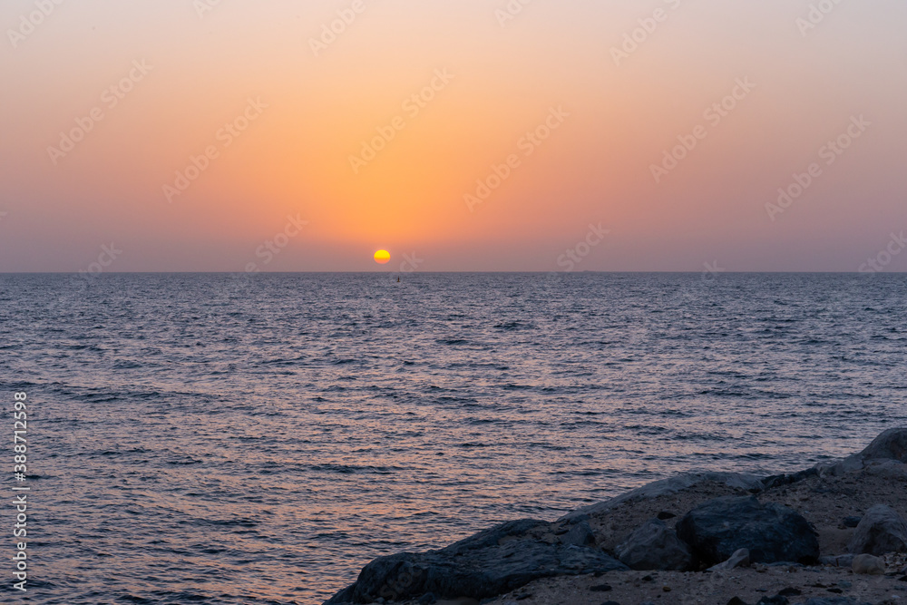 Plain golden sunset over the Gulf in Dubai, United Arab Emirates, seen from Bluewaters Island.