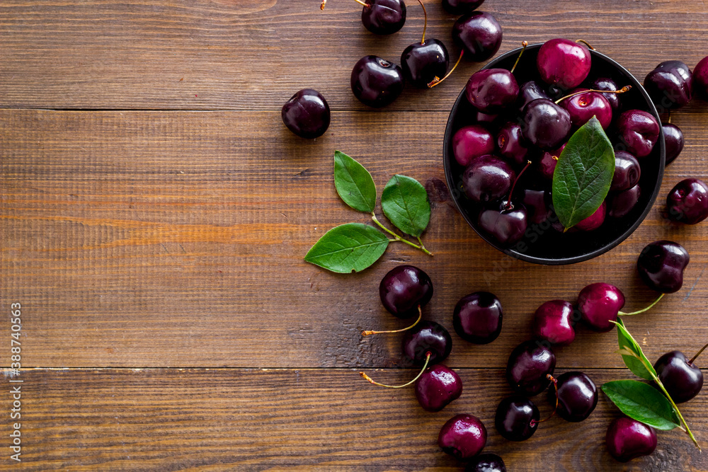 Sweet red cherries with leaves, flat lay, top view