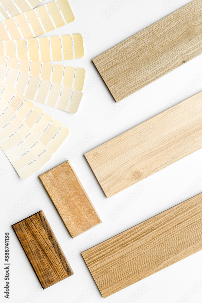 Wooden board floor and furniture samples with color scheme. Top view