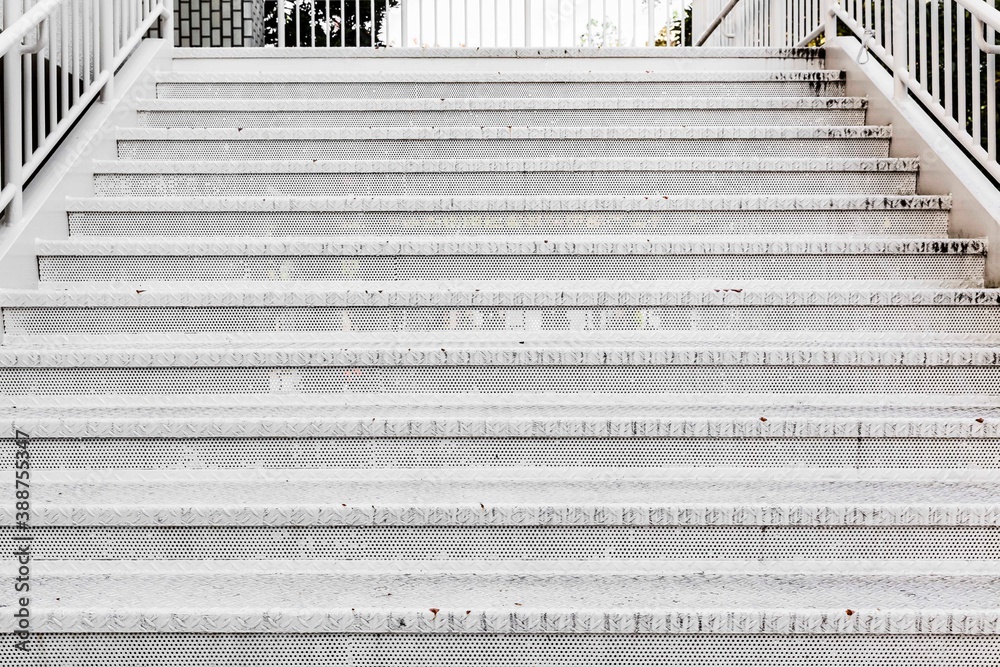 White painted steel stairs outside the building