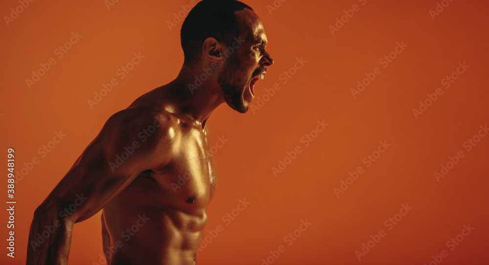 Close up of fit muscular man shouting