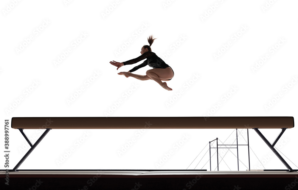 Female gymnast doing a complicated trick isolated on white.