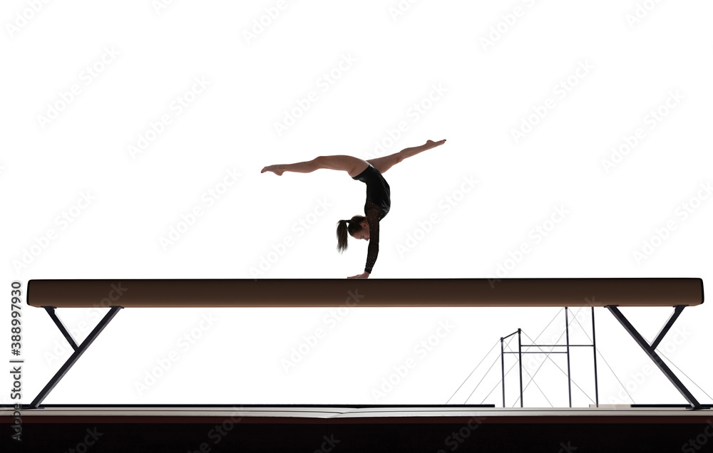 Female gymnast doing a complicated trick isolated on white.