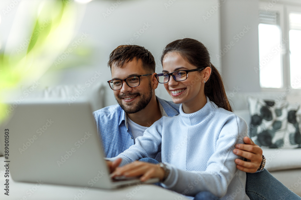 Wearing glasses, smiling face.