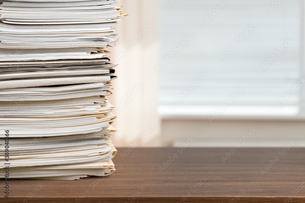 Stack of document papers on wooden desk