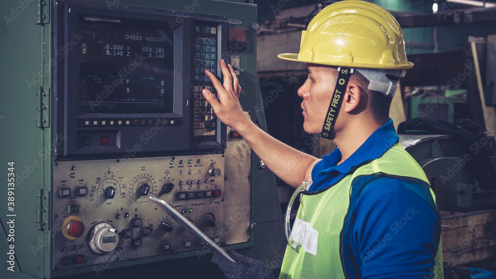 Smart factory worker using machine in factory workshop . Industry and engineering concept.