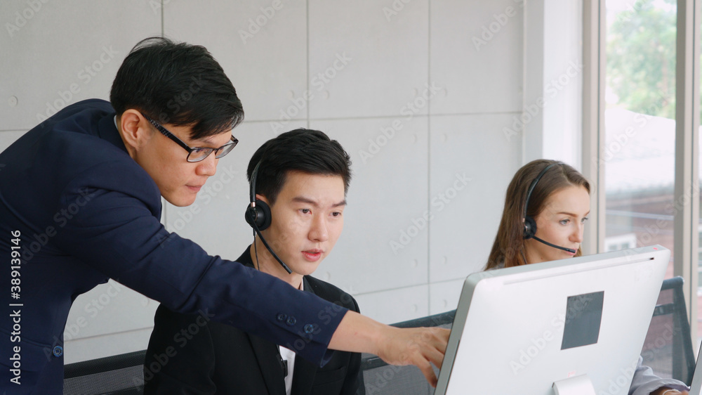 Business people wearing headset working in office to support remote customer or colleague. Call cent