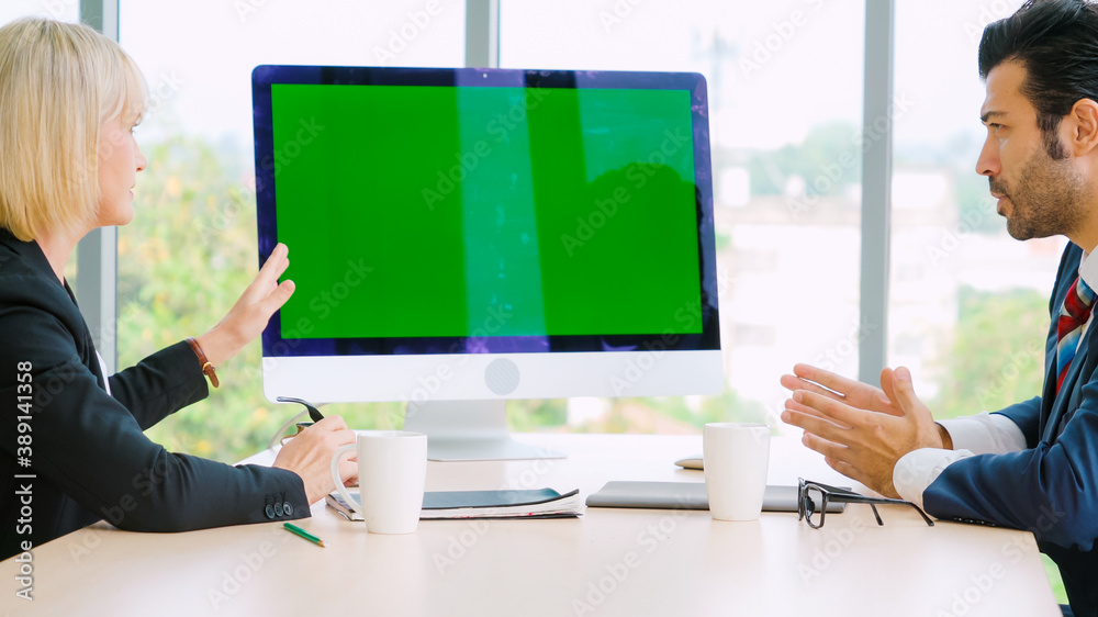 Business people in the conference room with green screen chroma key TV or computer on the office tab