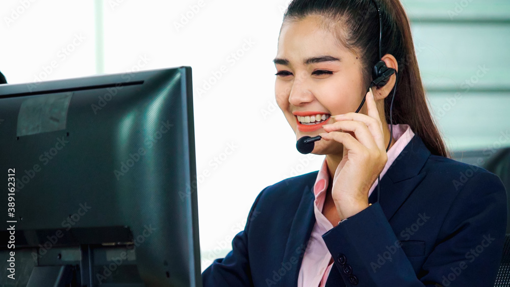 Business people wearing headset working in office to support remote customer or colleague. Call cent