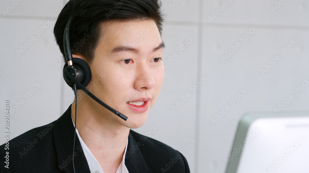 Business people wearing headset working in office to support remote customer or colleague. Call cent