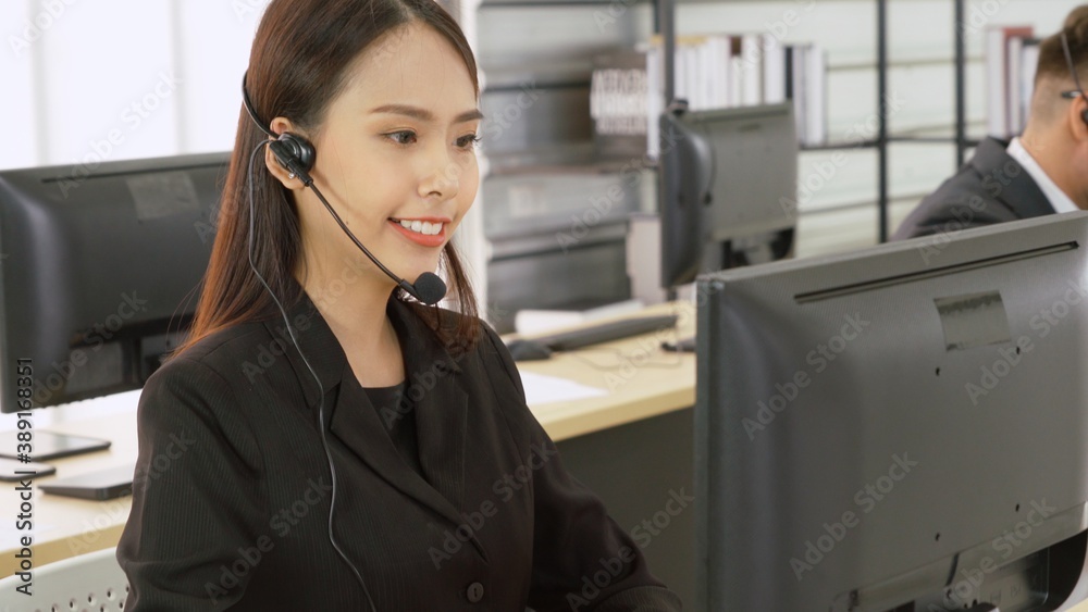 Business people wearing headset working in office to support remote customer or colleague. Call cent