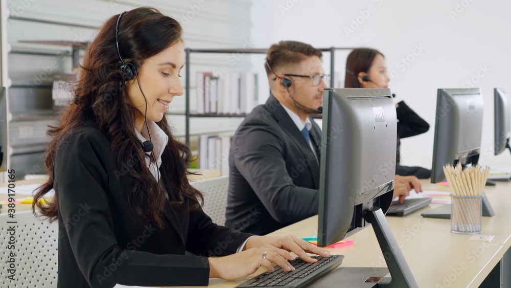 Business people wearing headset working in office to support remote customer or colleague. Call cent