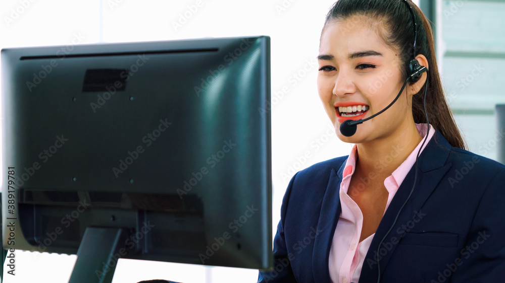 Business people wearing headset working in office to support remote customer or colleague. Call cent