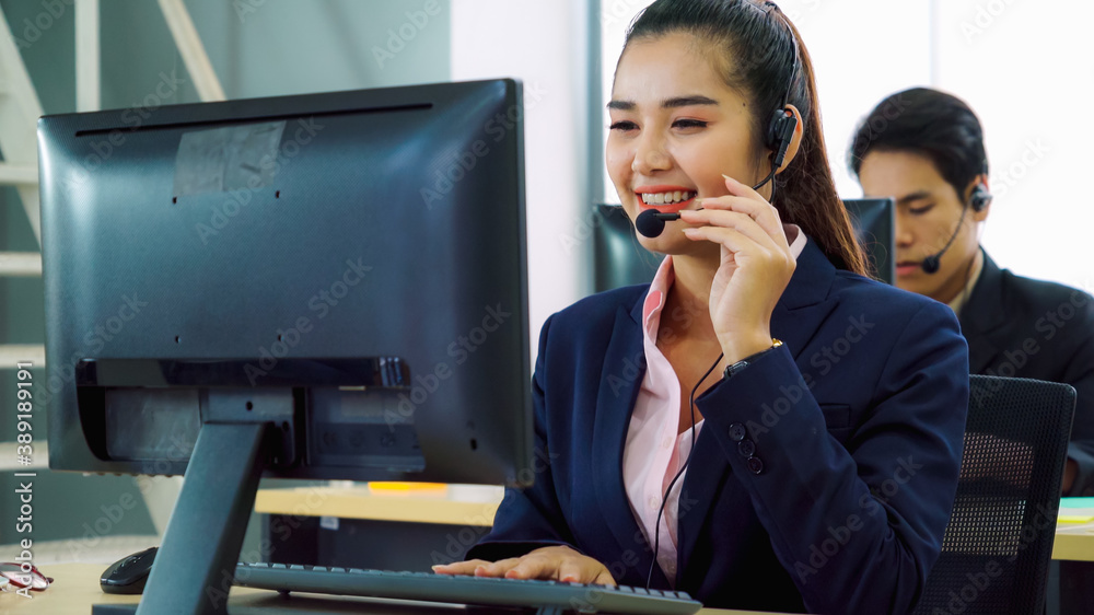 Business people wearing headset working in office to support remote customer or colleague. Call cent