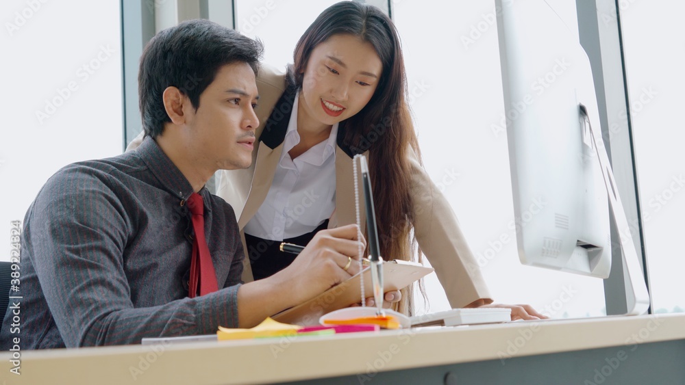 Two business people talk project strategy at office meeting room. Businessman discuss project planni