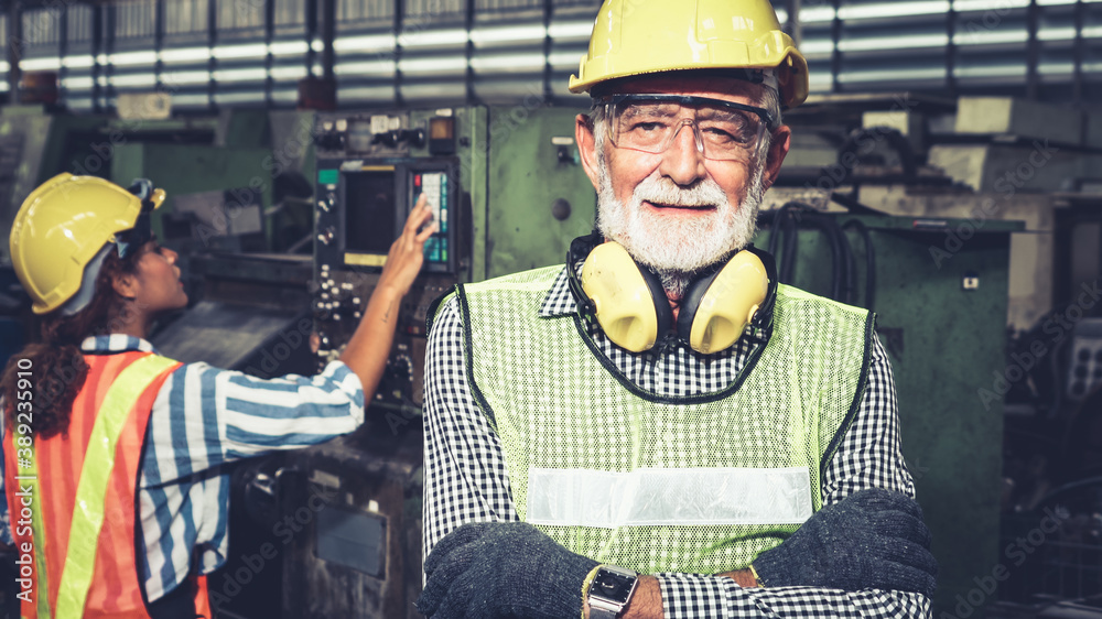 Senior factory worker or engineer close up portrait in factory . Industry and engineering concept .