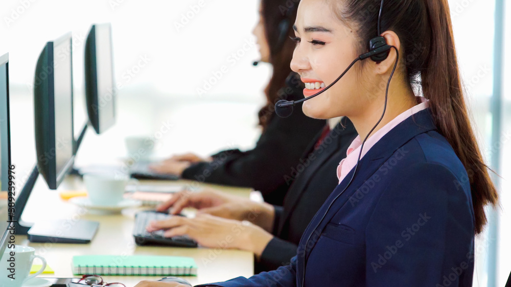 Business people wearing headset working in office to support remote customer or colleague. Call cent