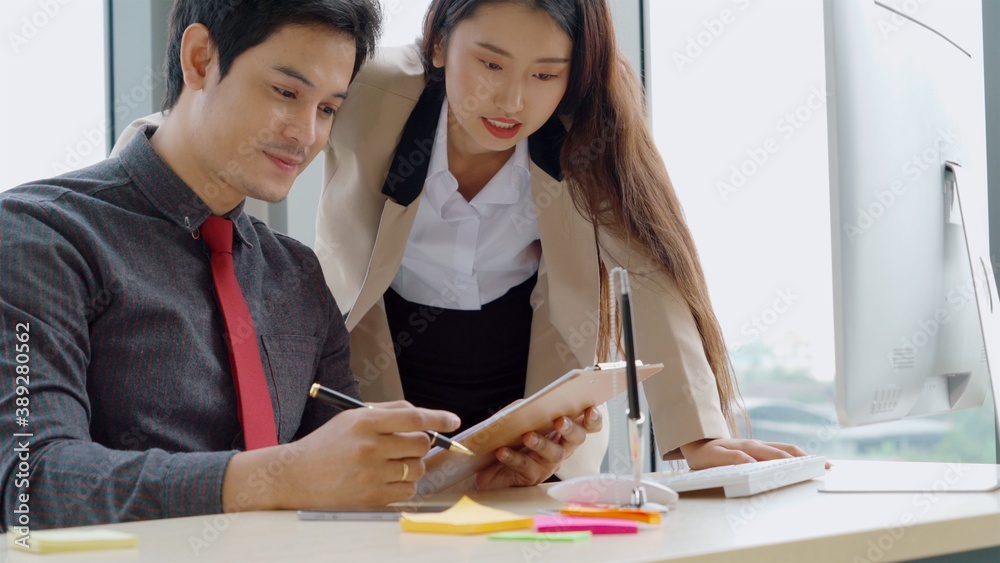 Two business people talk project strategy at office meeting room. Businessman discuss project planni