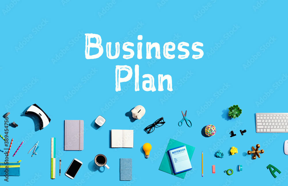 Business plan with collection of electronic gadgets and office supplies