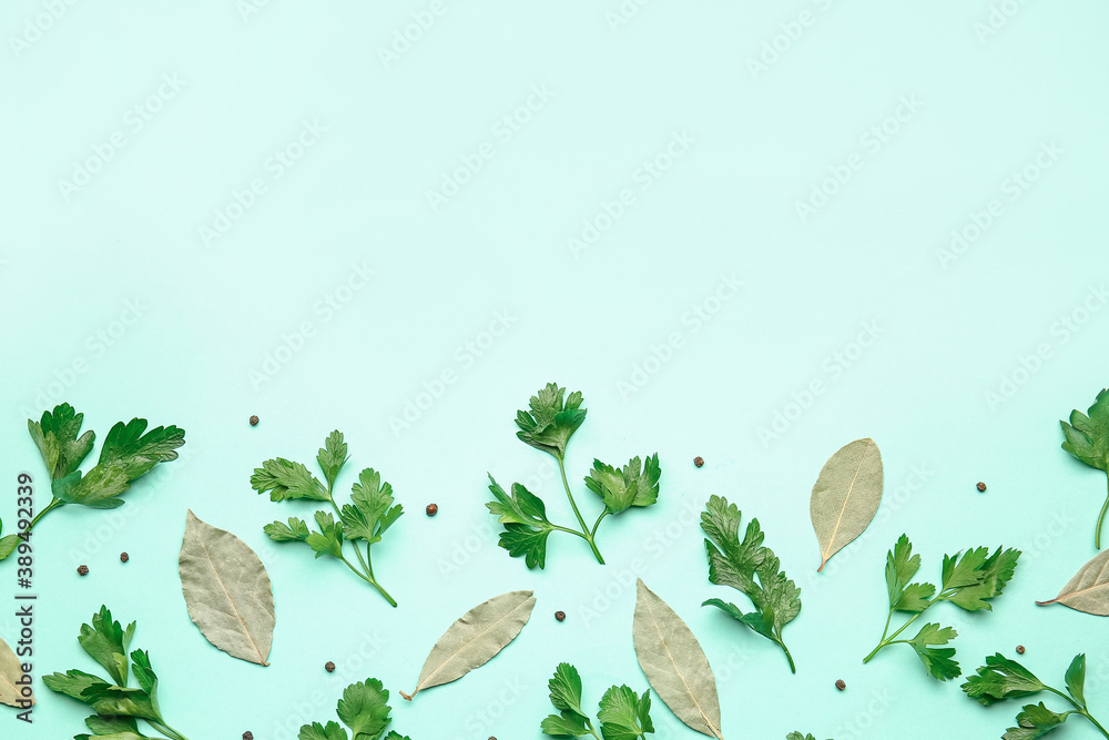 Fresh parsley and spices on color background