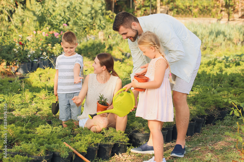 Young family working in garden