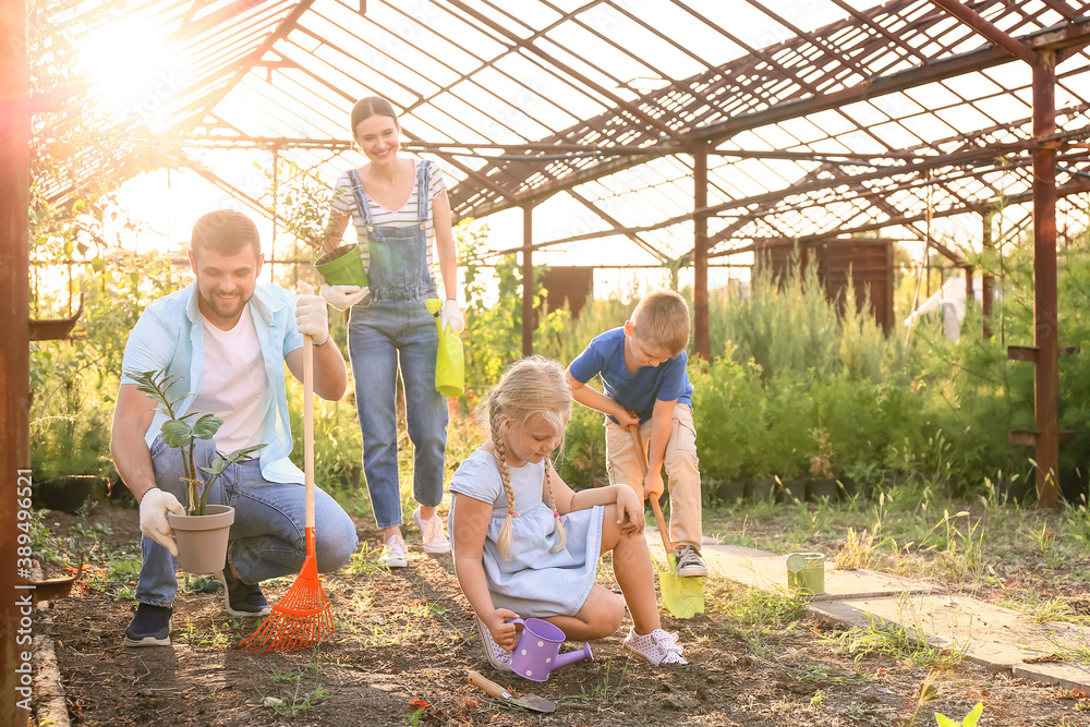 Young family working in garden