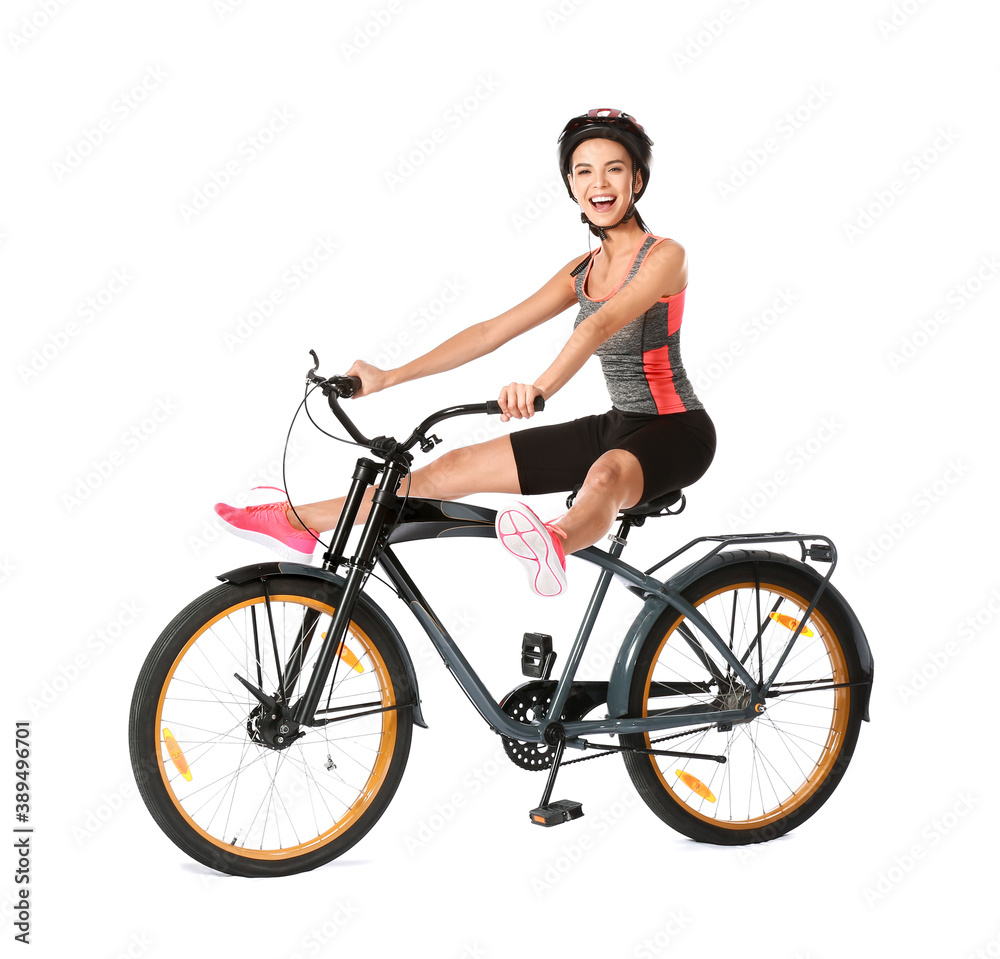 Female cyclist riding bicycle on white background