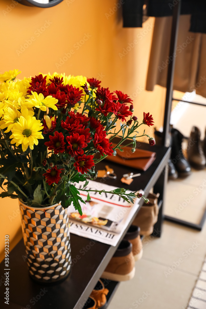 Stylish interior of modern hall with autumn flowers