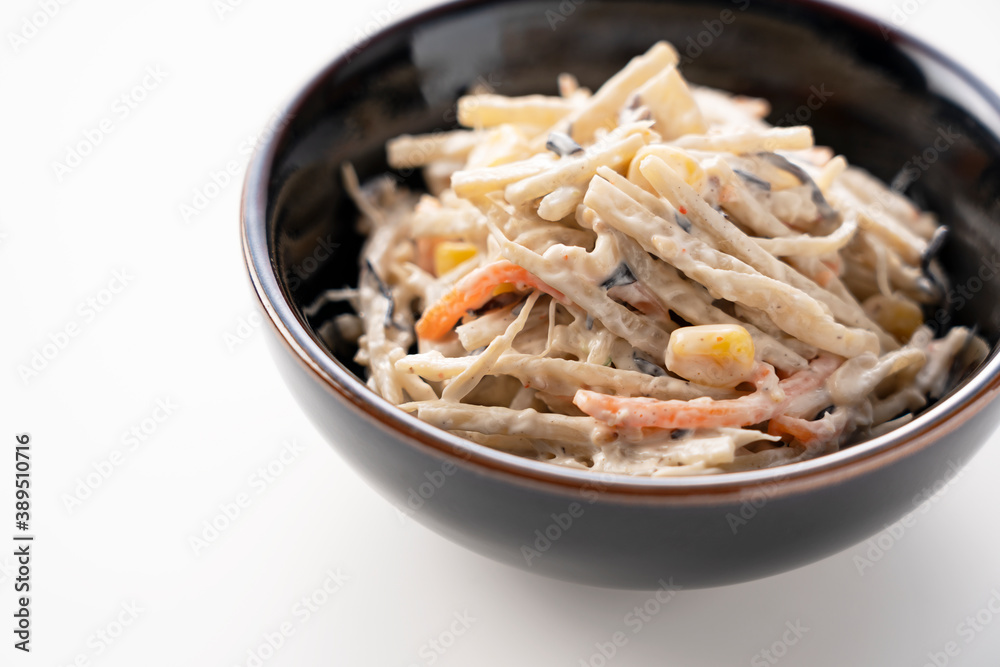 Burdock salad on a white background