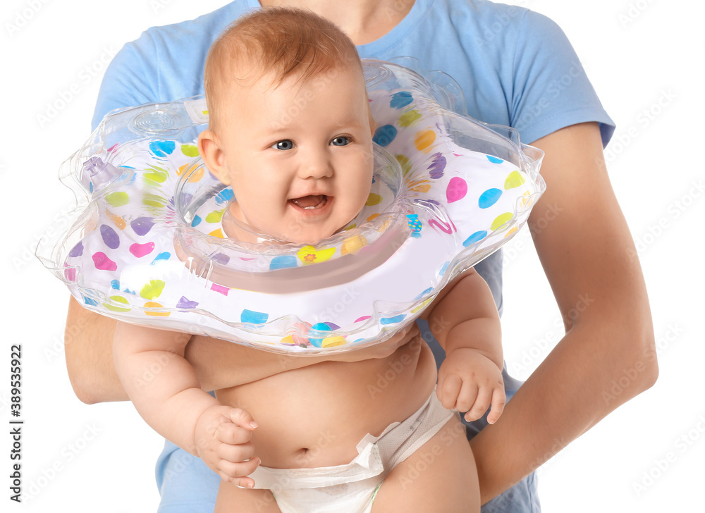 Woman and cute baby with inflatable ring on white background