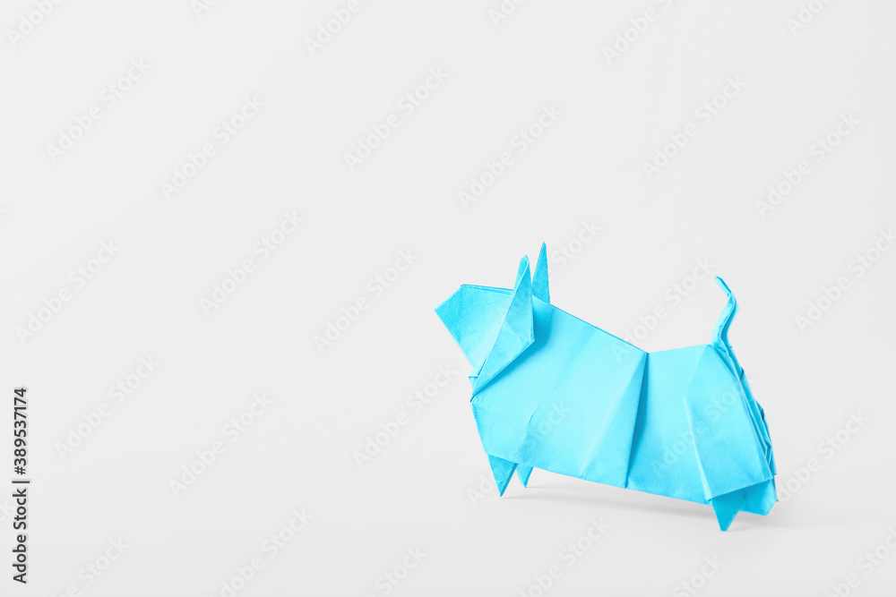 Origami bull as symbol of year 2021 on white background