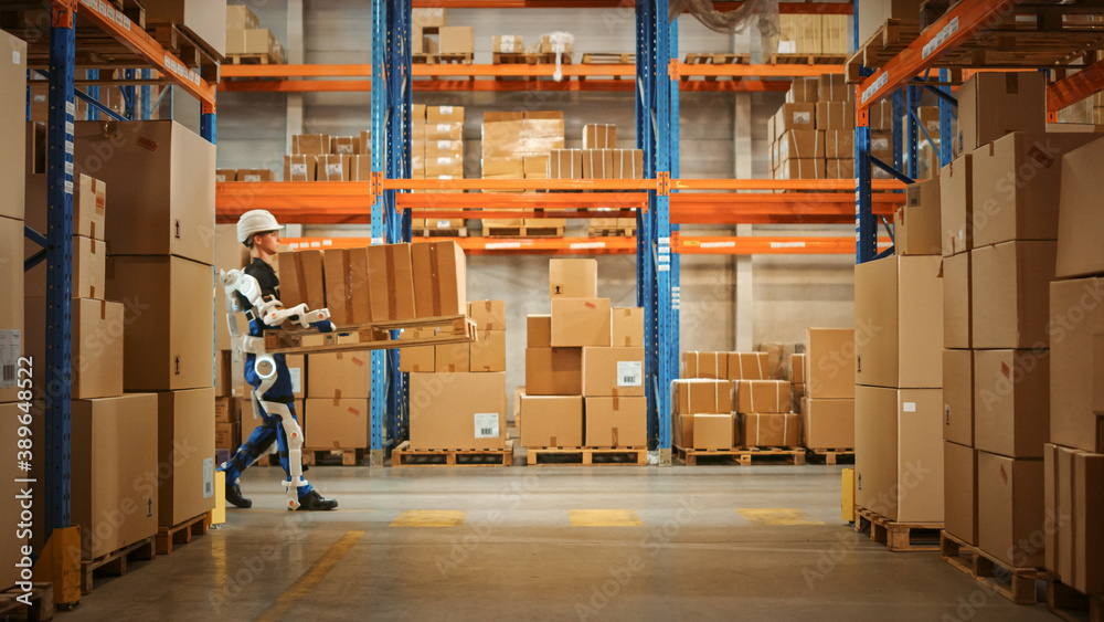 High-Tech Futuristic Warehouse: Manager Scans Packages for Inventory, Delivery in the Background Wor