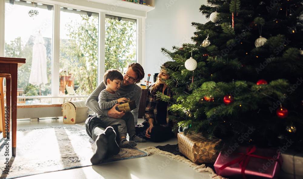 Family celebrating Christmas with gifts