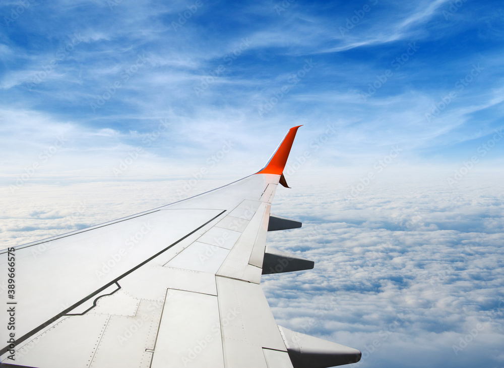 Wing of the plane on sky