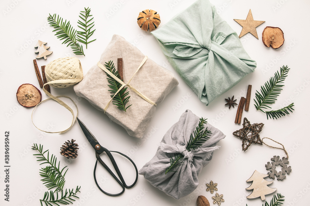 Fabric wrapped gifts and wooden Christmas decorations