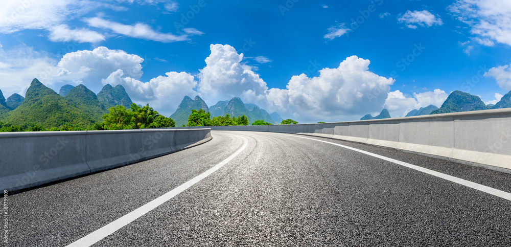 Country asphalt road and green mountain natural scenery in Guilin,China.