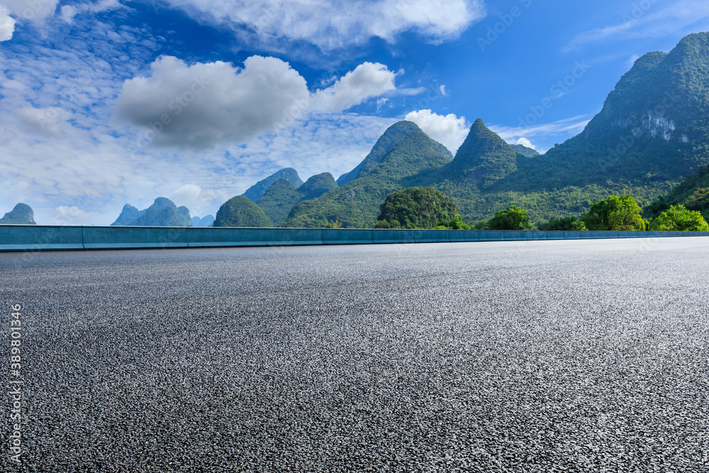 Asphalt highway and green mountain natural scenery in Guilin,China.