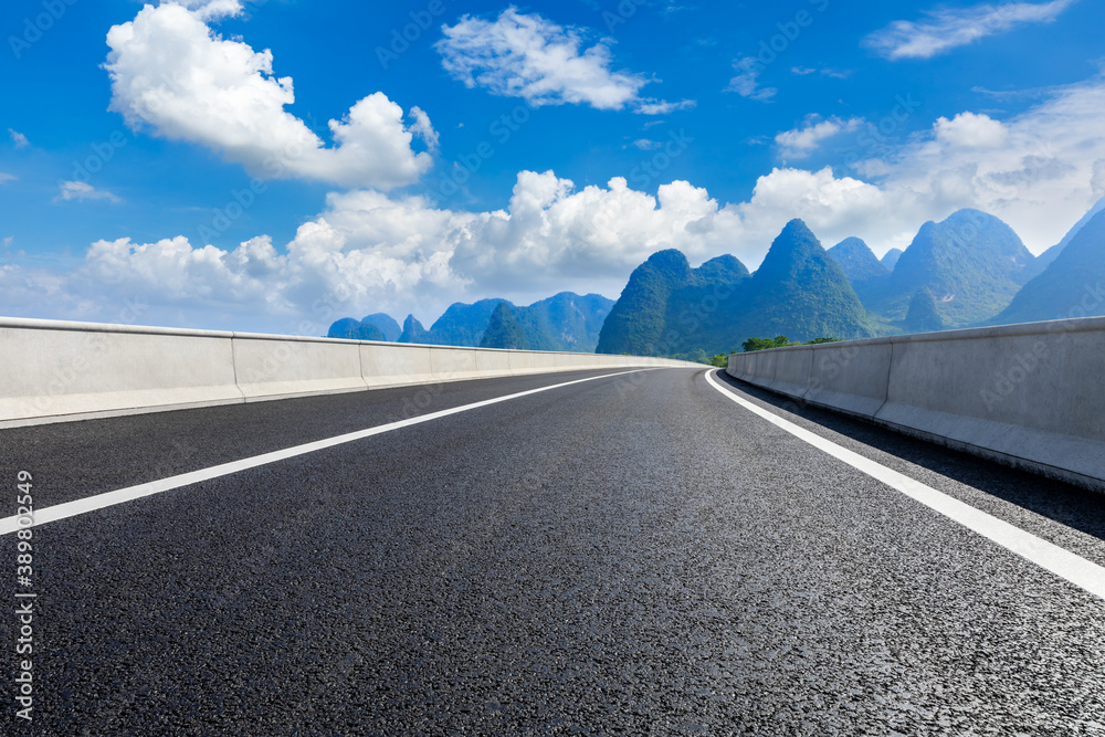 Asphalt highway and green mountain natural scenery in Guilin,China.