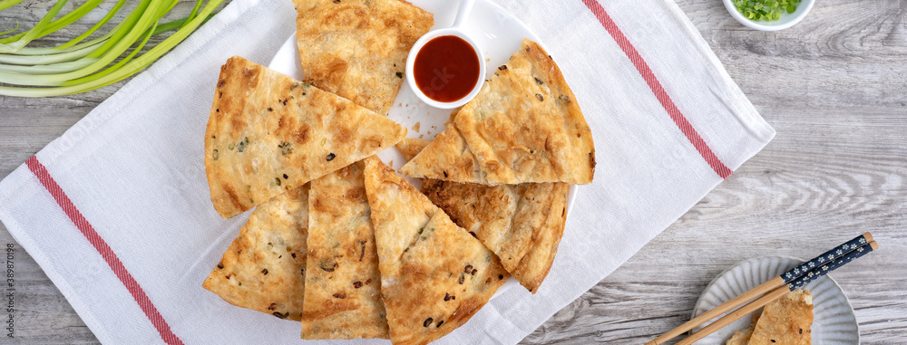 Taiwanese delicious scallion pancake over wooden table background