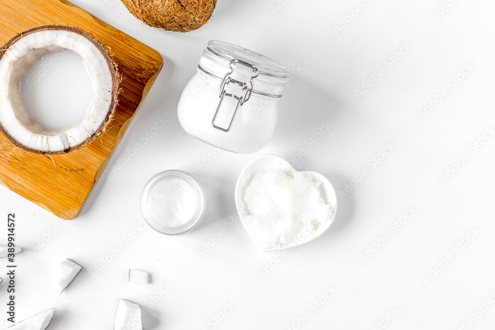 organic cosmetics with coconut on white background top view