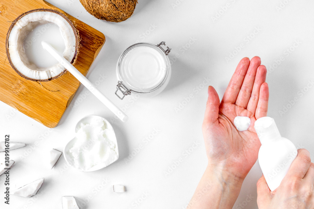 organic cosmetics with coconut on white background top view