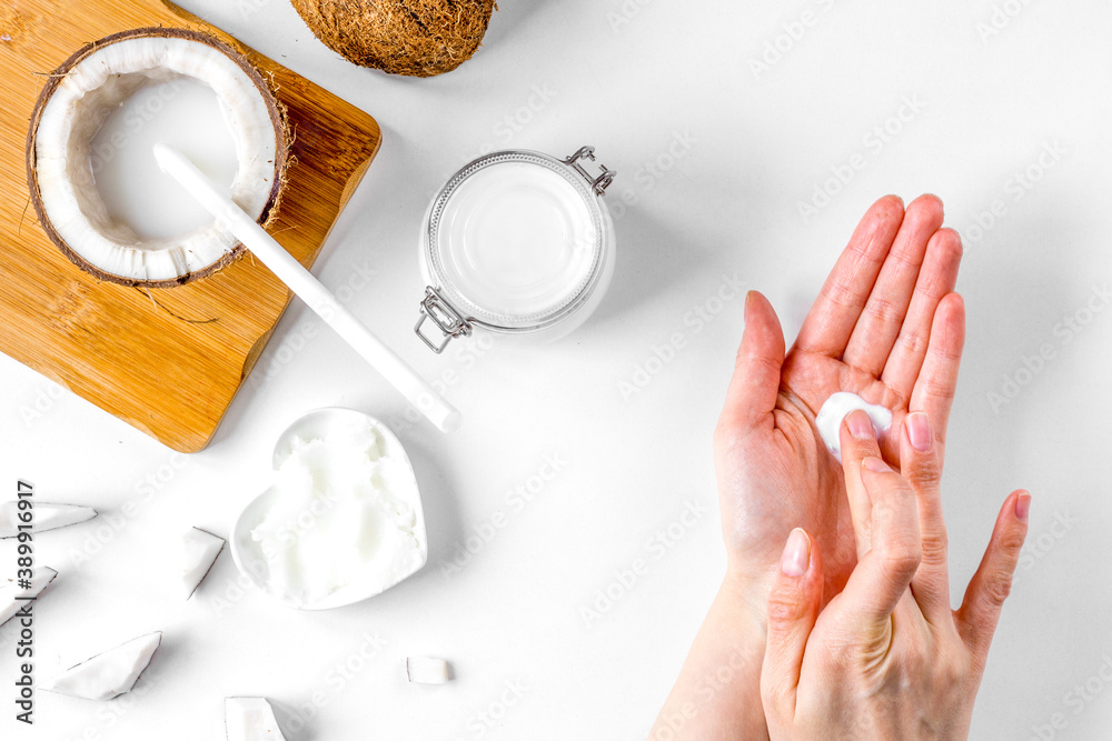 organic cosmetics with coconut on white background top view