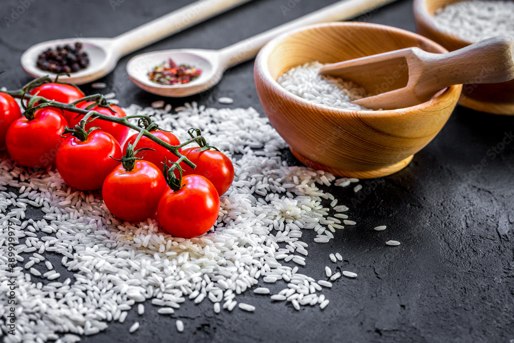 ingredients for paella on dark background