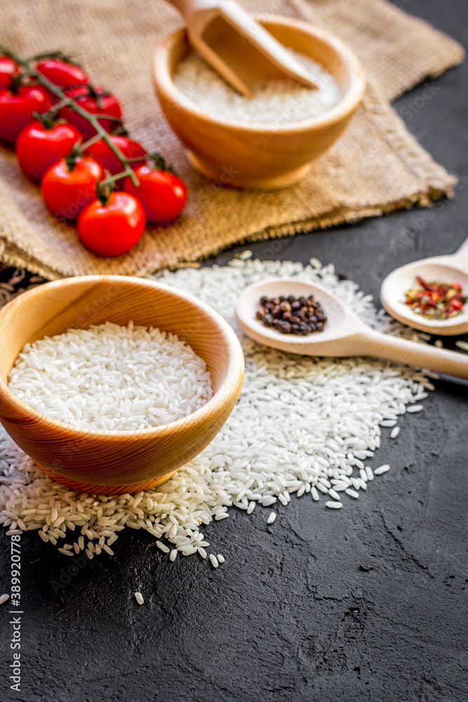 ingredients for paella on dark background