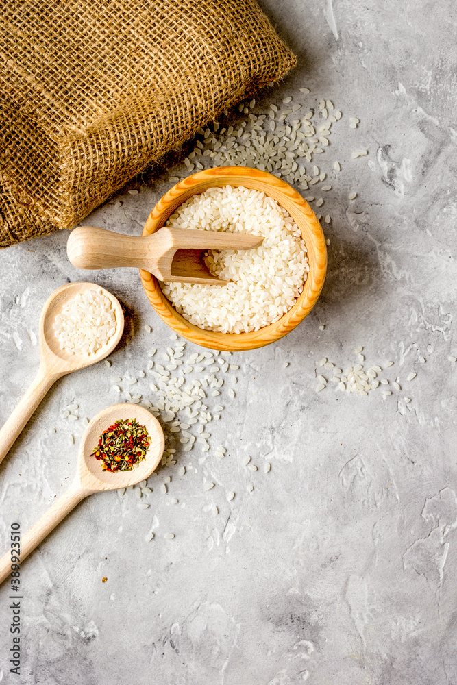 rice for paella on stone background top view mock up