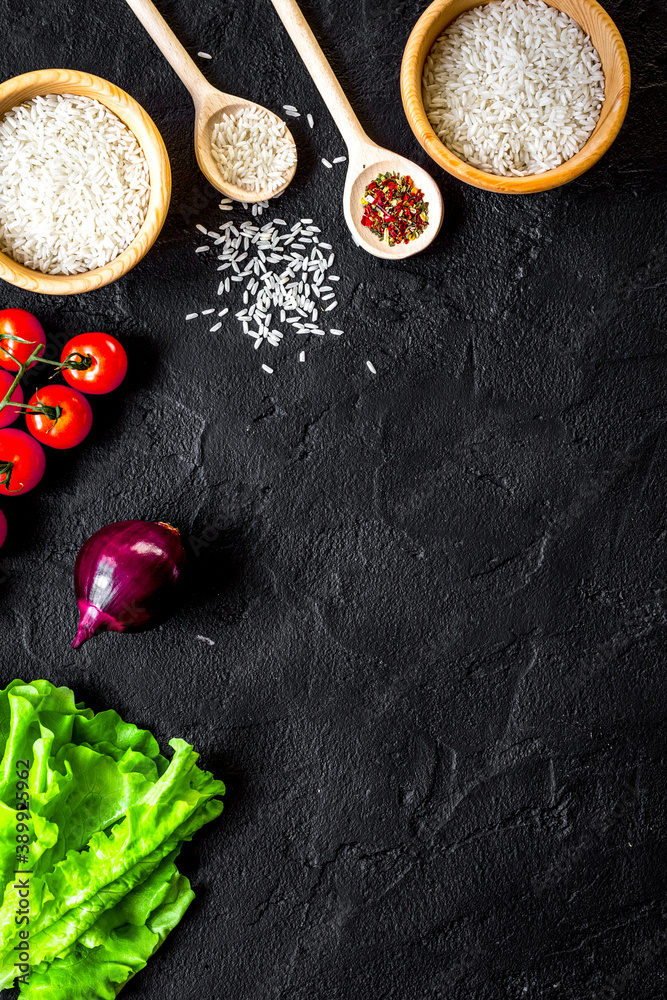 ingredients for paella on dark background top view